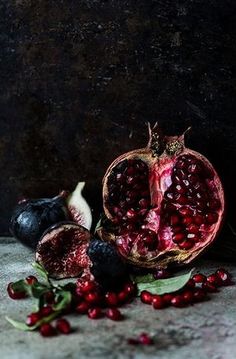 pomegranates and other fruits on a table