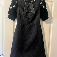 Beautiful Black Brocade Semi Formal Dress In A Classic Style Accented With Velvet, Grosgrain Ribbon Bow, And Jeweled Bees. Measurements Are Shown With Dressmaker Tape. Runs Small. Though It Says Large, I Believe It To Be A Size 2. Feel Free To Ask Me About It. Black Puff Sleeve Dress With Lace Trim, Semi Formal Black Dress, Gold Lace Wedding Dress, Semi Formal Dresses Black, Steampunk Wedding Dress, Ross Dresses, Pronovias Wedding Dress, Amanda Uprichard Dress, Disney Wedding Dresses