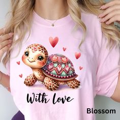 "💚 🐢 Dive into the sea of love with our Comfort Colors Lubby Dubby Turtle T-shirt, the perfect Valentine's Day treat. Crafted for comfort and adorned with a whimsical turtle design, this tee captures the essence of love and playfulness. The Lubby Dubby Turtle, with its heart-shaped shell, symbolizes the deep connection and affectionate bond shared between loved ones. Embrace the cozy softness of Comfort Colors as you celebrate the season of love. Whether it's a thoughtful gift for your significant other or a delightful addition to your Valentine's Day wardrobe, this charming turtle tee is a delightful expression of affection and comfort. ❤️🌹💖 Key Features: - Premium Comfort Color Shirt - 100% Ring-Spun US Cotton - Relaxed Fit for All-Day Comfort - Classic Crew Neckline - Pre-Shrunk Fab Printed Pink T-shirt As Gift, Pink Printed T-shirt As A Gift, Playful Pink T-shirt For Valentine's Day, Valentine's Day Gift Ideas, Turtle Design, Valentines Day Treats, Deep Connection, Color Shirt, Valentine Day Love