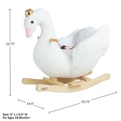 a white swan rocking toy with a gold crown on it's head and feet