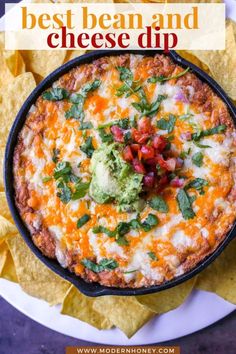 the best bean and cheese dip in a black skillet with tortilla chips