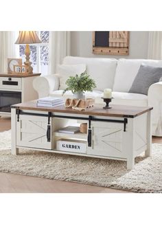 a living room with a white couch and coffee table