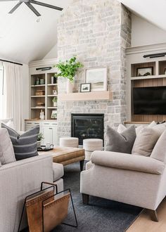 a living room filled with furniture and a fire place