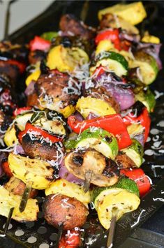 the skewers are covered with vegetables and cheese