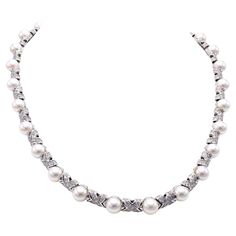 Beautifully designed and masterfully handcrafted by the iconic Italian jewelry house Bulgari, this wonderful necklace features bright white and sparkly round brilliant cut diamonds embellished by white lustrous pearls all set in 18 karat white gold. In an X design 27 elements are channel set with 9 diamonds each with an approximate total diamond weight of 7 carats. A wonderful and most wearable piece of signed jewelry. 16 1/8 inches long. Signed Bulgari on clasp with Italian control marks. Origi Bulgari Pearl Necklace, Bulgari Jewelry, Bvlgari Jewelry, Pearl And Diamond Necklace, Italian Jewelry, Pearl Diamond, Choker, Leather Pouch, Round Brilliant Cut Diamond