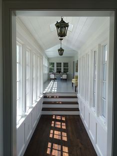 the sun shines through the windows in this hallway