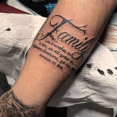 a man with a tattoo on his arm that says family and the words are written in cursive font