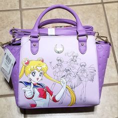 a purple handbag with sailor moon on it