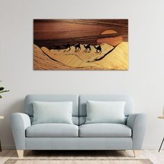 a living room scene with a couch and painting on the wall in front of it