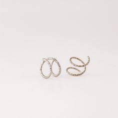 Tiny Double Hoop Earrings, Minimal Spiral Earrings, Tiny Twist Earrings, Double Hoop Earrings, Double Piercing, Diamond Cut Hoop EarringsTwist these little coils in and instantly get the appearance of two lobe piercings.(You only need ONE piercing to make these work-- they give the look of two!)(It can also be worn with two holes in case you have them)All you do is thread one side through your first hoop until the other side sits comfortably on your earlobe giving the illusion of a second hole. Modern Twist Nickel Free Hoop Earrings, Modern Twist Nickel-free Hoop Earrings, Silver Spiral Cartilage Earrings As Gift, Adjustable Silver Spiral Cartilage Earrings, Silver Spiral Ear Cuff, Silver Hoop Ear Cuff, Silver Spiral Hoop Earrings In Metal, Small Hoop Metal Single Wrap Earring, Silver Spiral Hoop Earrings With Ear Wire