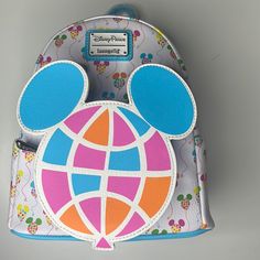 Adorable Disney Mickey Mouse Balloon Loungefly Mini Backpack Disney Parks Epcot. Great Collectible. New With Tags!! - Simulated Leather Mini Backpack - Contrast Trims - Two Side Exterior Slip Pockets - Front Zip Coin Purse Compartment - Loungefly Logo Metal Pulls - Adjustable Padded Shoulder Straps - Top Carry Handle - Disney Parks X Loungefly Logo Label Plate Approx. 10 1/2'' H X 9'' W X 4 1/2'' D White Disney Travel Backpack, Multicolor Disney Bags For Back To School, Cute Multicolor Backpack For Disney Trips, Cute Multicolor Bags For Disney Trips, Multicolor Disney Standard Backpack, Fun White Backpack, Disney Multicolor Backpack For Daily Use, Disney Multicolor Backpack For Everyday Use, Multicolor Disney Backpack For Daily Use