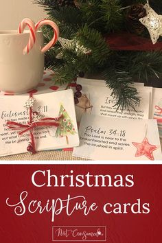 some christmas cards with candy canes on them next to a tree and other decorations