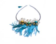 Flirty fringes and feminine mesh metal flowers meet in beautiful and unique textured statement necklace. Features petroleum green fringe, beaded brass mesh flowers and silver grey glass beads. Length: 23 inches and 1 1/2 extra inches extender with a playful tassel in the end (59+4cm)- Can be shortened upon request! Your necklace comes beautifully gift wrapped and ships within 1-3 days of purchase via priority registered air mail. More items from the Color Dot Collection see here: http://www.etsy Bohemian Fringe Choker Jewelry, Bohemian Fringe Choker Necklace, Handmade Bohemian Flower Necklace For Spring, Bohemian Handmade Flower Necklace For Spring, Bohemian Flower Jewelry For Party, Bohemian Adjustable Flower Necklace For Parties, Adjustable Bohemian Flower Necklace For Party, Bohemian Flower Necklace For Parties, Silver Bohemian Necklace For Spring