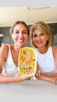 two women sitting at a table with an ice cream dish in front of them and the caption persian ice cream