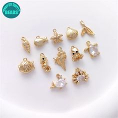 14k Gold Plated Ocean Charm Set,ocean charms,jewelry charms,sea charms,Animal Charm,bracelet charm,Earring Pendant ❥Material: Base metal: Brass Real 14K Gold plated Brass,with Color protecting Layer. ➤Lead free;Nickel Free ❥Size: Please refer to the Pic ❥ Shipping ➤We ship from China. ➤Usually It will take 2-3 Weeks to US ➤Usually It will take 2-4 Weeks to other countries Ocean-inspired Charms For Jewelry Making, Ocean-inspired Charm Necklaces For Gifts, Ocean-inspired Charm Necklaces As Gift, Ocean-inspired Charm Necklaces As Gifts, Ocean-inspired Charm Necklace For Gift, Ocean-inspired Dangle Charms Jewelry, Gold Pearl Charm For Jewelry Making, Gold Ocean-inspired Jewelry With Dangling Charms, Ocean-inspired Gold Jewelry With Dangling Charms