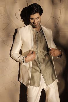 White jacket with pearl embroidered placket. Paired with green kurta and pant. - Aza Fashions Traditional Embroidered Blazer For Reception, Traditional Wedding Kurta With Embroidered Cuffs, Elegant Bandhgala With Embroidered Border For Designer Wear, Elegant Long Sleeve Bandhgala With Embroidered Border, Elegant Long Sleeve Sherwani With Embroidered Border, Festive Elegant Bandhgala With Embroidered Border, Elegant Wedding Bandhgala With Embroidered Border, Traditional Festive Blazer With Intricate Embroidery, Festive Traditional Blazer With Intricate Embroidery