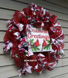 a christmas wreath with the words seasons greetings on it