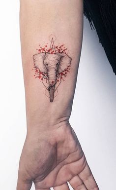 an elephant's head is shown on the wrist and it has blood splatters all over it