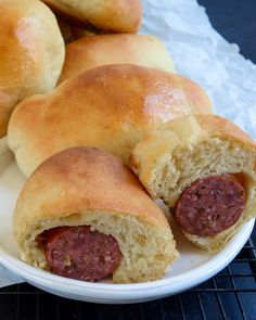 two sausage rolls on a white plate