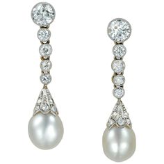 A pair of Edwardian pearl and diamond drop earrings, each earring consisting of a natural drop pearl surmounted from a rose-cut diamond set fluted cap suspended from five graduating old brilliant-cut diamonds, estimated to weigh a total of 1.6 carats, millegrain rub over set in white to a gold mount with post and alpha fittings, circa 1910, measuring 3.4 x 0.8cm, gross weight 5.5 grams. Edwardian earrings in very good. Unmarked tested as Platinum and 18ct Gold. These refined pearl earrings are a Natural Pearl Earrings, Diamonds And Pearls, Diamond Cluster Earrings, Earrings For Sale, Pearl And Diamond Earrings, Natural Pearl, Diamond Drops, Diamond Drop Earrings, Antique Earrings