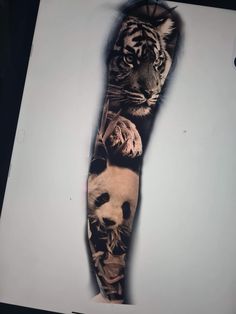 an arm tattoo with a tiger and panda on it