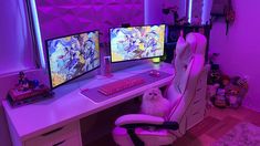 a white dog sitting on a chair in front of a computer desk with two monitors