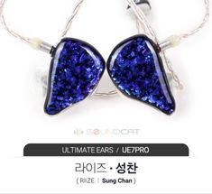 the earphones are made out of glass and have blue glitters on them,