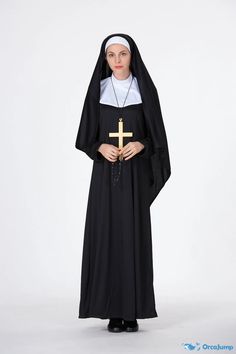 a woman wearing a black nun outfit with a cross on the chest and hands in her pockets