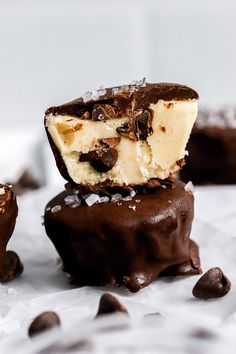 three pieces of chocolate covered dessert sitting on top of each other