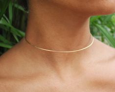 "My take on minimalist design, the Simple Wire Choker is made of 16 gauge gold, rose gold, or silver wire, hand forged out of a single piece, with a hook and loop closure. The small size is super easy to wear, and looks great with hair up or down. Due to it's thin diameter, this choker looks amazing paired with other necklaces as well as makes a subtle statement on its own. Features a very lightly hammered texture and a satin finish. Choose from: -brass (golden tone) -Sterling Silver -14k Gold F Metal Choker Necklace, Wire Choker, Simple Choker, Metal Choker, Hair Up Or Down, Choker Gold, Prom Accessories, Basic Jewelry, Wire Work Jewelry