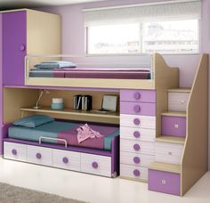 a child's bedroom with purple and green furniture