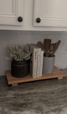 the kitchen counter is clean and ready to be used as a utensil holder