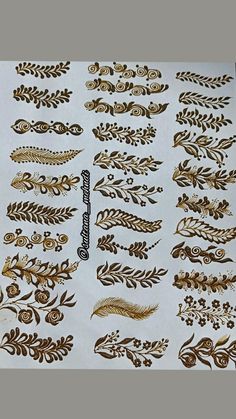 an assortment of gold and white designs on paper