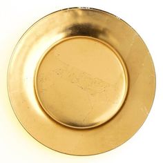 an empty gold plate on a white background