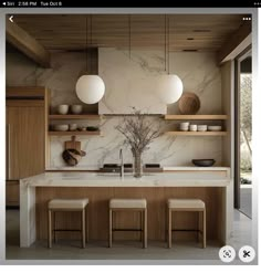 an image of a kitchen with marble counter tops and wooden shelves on the wall, along with three stools