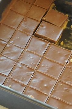 a pan filled with chocolate squares sitting on top of a counter