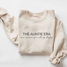 a sweater with the words the aumite era on it