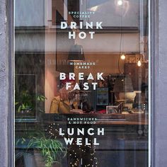 there is a sign in the window that says drink hot and break fast