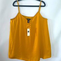 Tank Top By Gap. Mustard-Yellow-Gold. Xs Trendy Gap Summer Tank Top, Trendy Gap Tank Top For Summer, Yellow V-neck Tank Top For Beach, Casual Gold Sleeveless Tank Top, Casual Gold Sleeveless Top, Gold V-neck Tank Top For Summer, Gold Sleeveless Casual Top, Yellow V-neck Tank Top For Summer, Trendy Gold Summer Tops