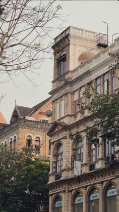 an old building with many windows and balconies