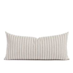 a striped pillow on a white background