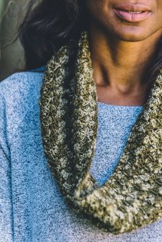 a close up of a person wearing a scarf