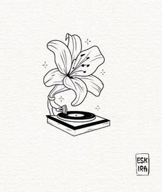 a black and white drawing of a flower on top of a turntable with vinyl