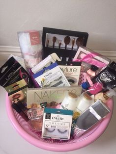 a pink basket filled with makeup and beauty products