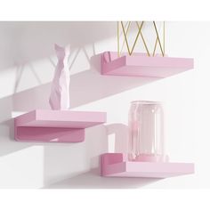 two pink shelves on the wall with vases and other items in front of them