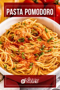 pasta pomodoro in a white bowl with basil on top