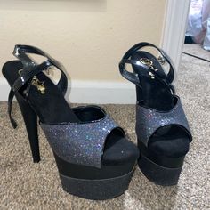 Black Pleaser Heels. Size 9. Worn Once For A Photo Shoot. Black Party Heels With 4-inch Heel, Black Open Heel Party Heels, Black Heels With 4-inch Heel For Party, Black Platform Heels For Party, Black Synthetic Heels For Party, Glamorous Black Heels With Heel Strap, Chic Black Glitter Heels, Glamorous Black Glitter Sandals, Black Closed Toe Glitter Heels