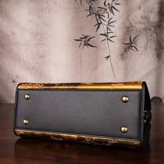 Description   清明上河图    Inspired by one of China's ten most famous paintings, “Qing ming Shang He Tu”, a hand-scroll painting by the Chinese painter Zhang Zeduan from the Song Dynasty, 745 years ago, which is also known as “China's Mona Lisa”.   Our luxurious silk handmade handbag showcases "Along the River During the Qingming Festival," one of China's top ten famous paintings. This masterpiece depicts vibrant scenes of ancient city life during the Song dynasty.  Crafted from Fragrant Cloud Silk Elegant Engraved Shoulder Bag, Elegant Engraved Rectangular Shoulder Bag, Engraved Rectangular Evening Bag, Formal Rectangular Engraved Bag, Formal Engraved Rectangular Bag, Engraved Rectangular Formal Bag, Artistic Rectangular Evening Bag, Merging Art, Qingming Festival