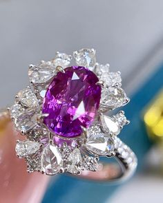 Bienvenue chez Odyssée Joaillerie, nous nous spécialisons dans le diamant coloré,  et les bagues de fiançailles. Nous offrons un grand choix: blanc, ou jaune, ou rose, platine,  nos bijoux sont finement fabriqués pour une qualité exceptionnelle! Symbole d'amour par excellence, le diamant est une belle preuve d'amour. Le joyau de vos rêves est le vôtre! Détails : Marque: Odyssée Joaillerie Métal : or blanc 18k  * Pierre centrale : Saphir Violet non chauffé 2,2ct  * Pierres latérales: Diamants inc Purple Sapphire Ring, Sapphire Wedding Rings, Purple Sapphire, Gold Cocktail Ring, Colorless Diamond, Dream Engagement, Modern Ring, Dream Engagement Rings, Bling Rings