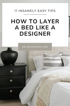 a bed with white sheets and black nightstands in front of it that says, how to layer a bed like a designer